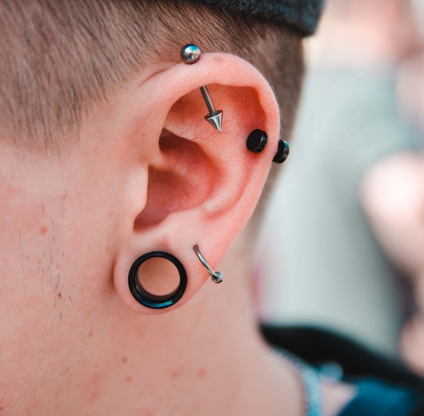 Man with stretched lobe piercing