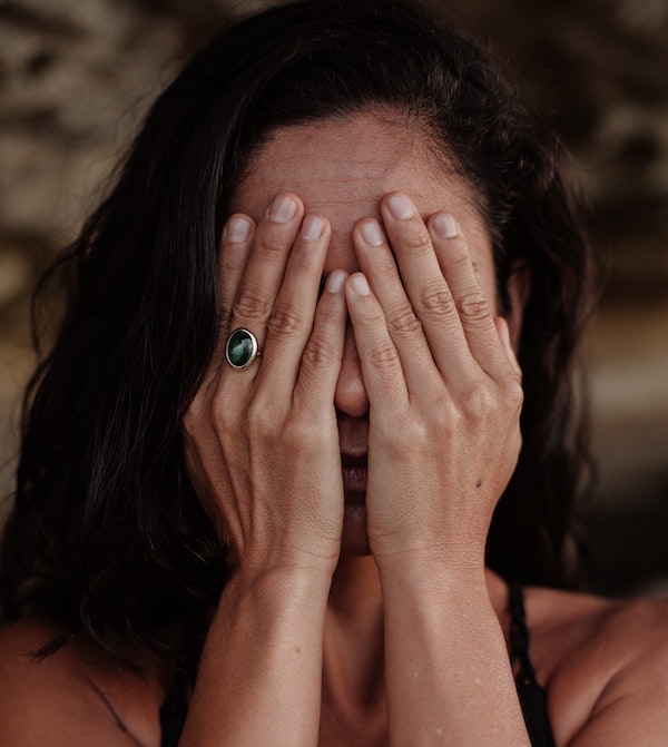 Woman Covering Her Face